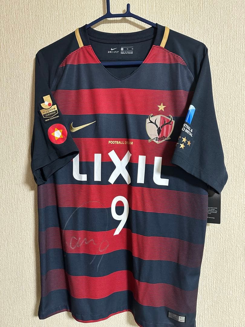 直筆サイン入 鹿島アントラーズ 鈴木優磨ユニフォーム 未使用タグ付き サイズXL