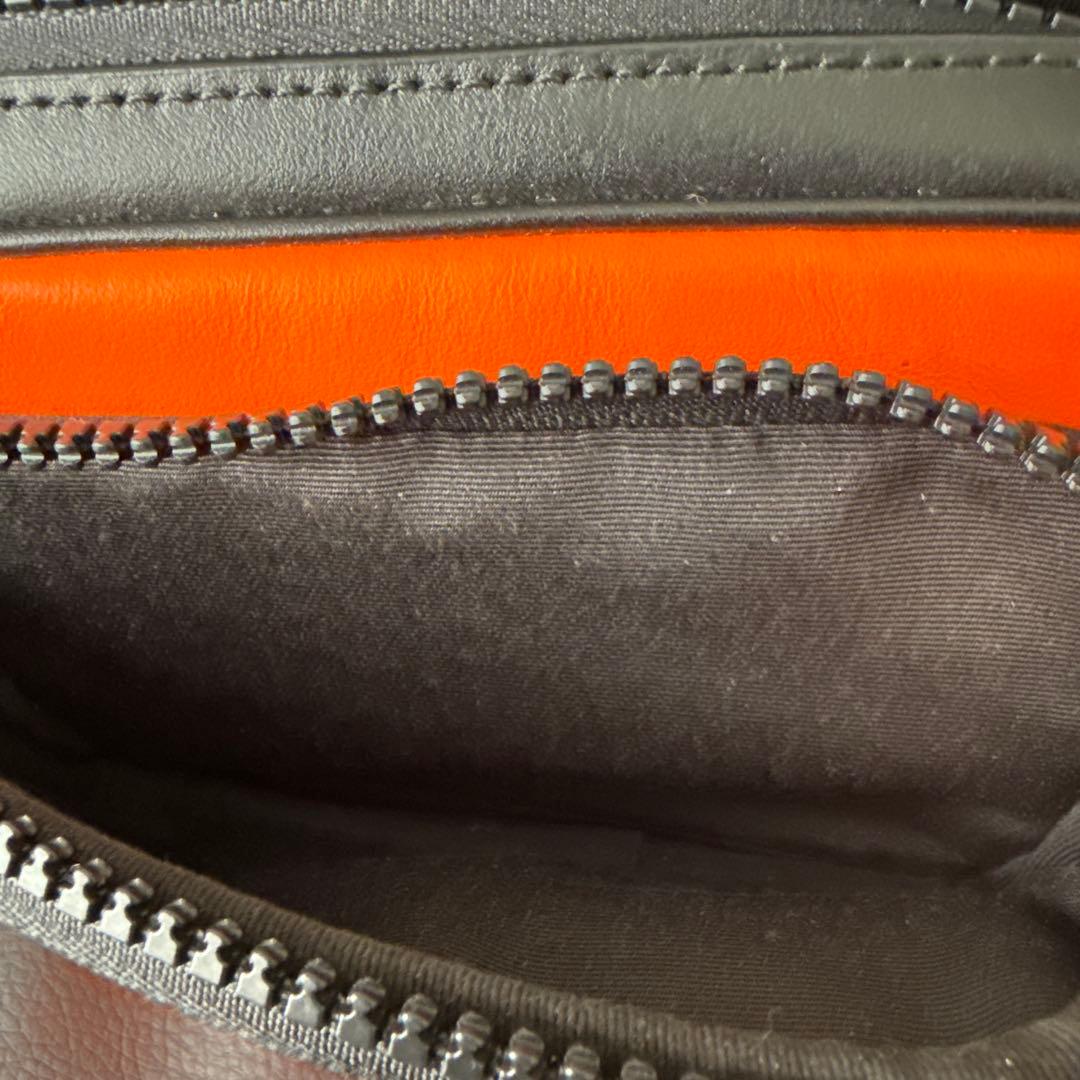 COACH ダブルジッパーバッグ オレンジ/黒