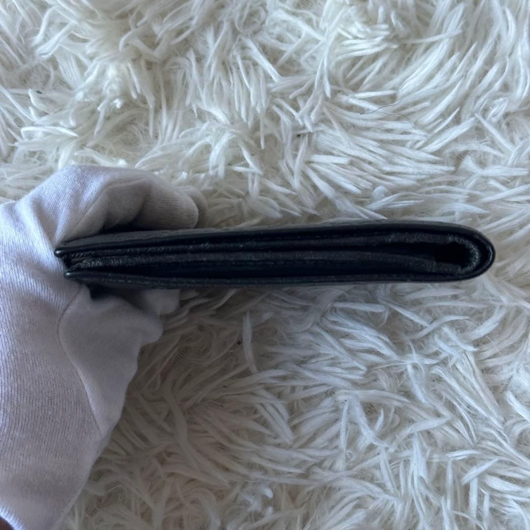 グッチ GGシマ 二つ折り財布 型押し レザー コンパクト 黒 総柄 エンボス