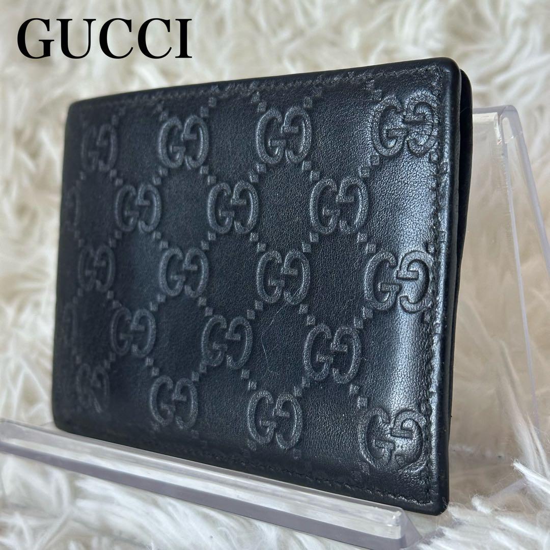 グッチ GGシマ 二つ折り財布 型押し レザー コンパクト 黒 総柄 エンボス