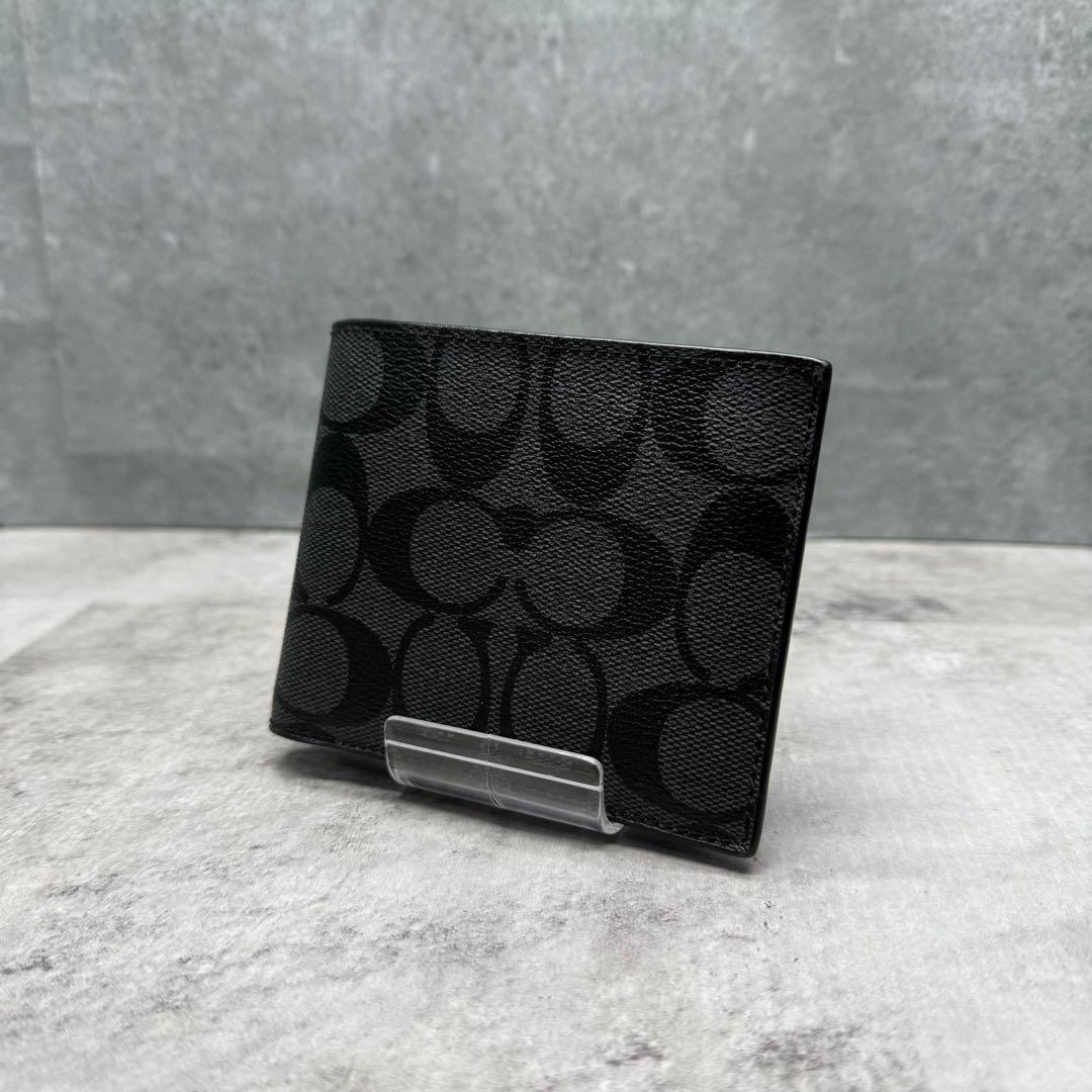 【美品】COACH コーチ 折り財布 PVC ブラック シグネチャー メンズ