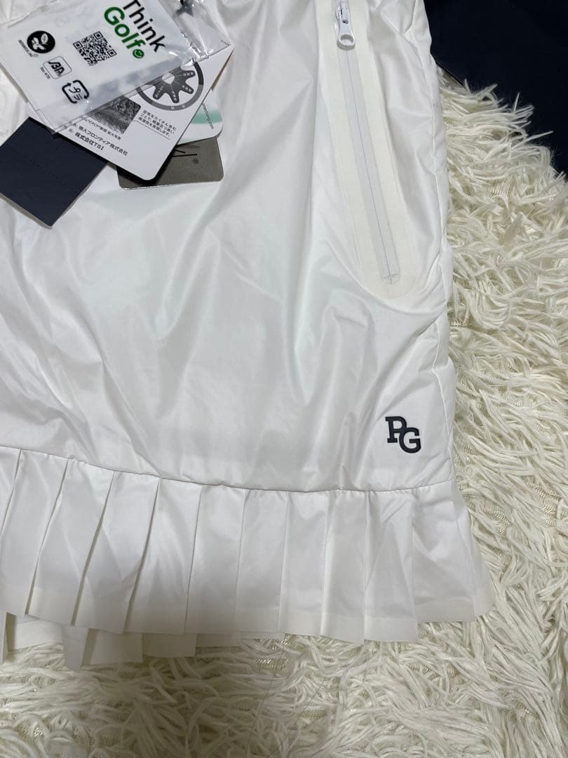 パーリーゲイツ 【軽量保温】バックロゴプリーツ切替タフタスカートサイズ2