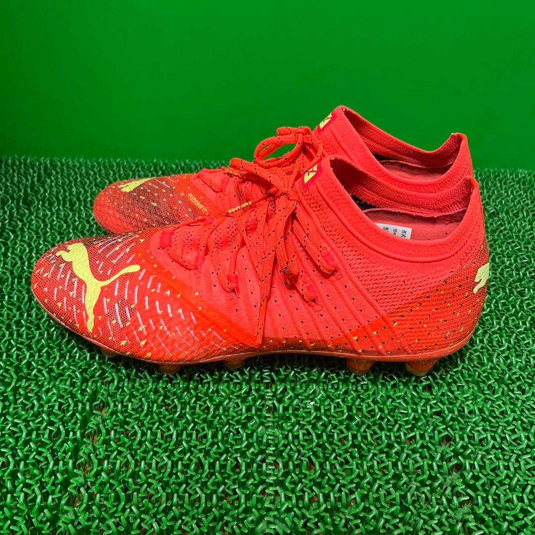プーマ サッカースパイクフューチャーZ 1.4 HG/AG(オレンジ×イエロー)