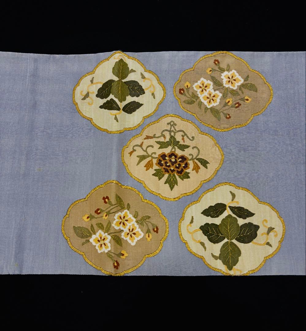 細かな明綴れ 青色 お太鼓柄