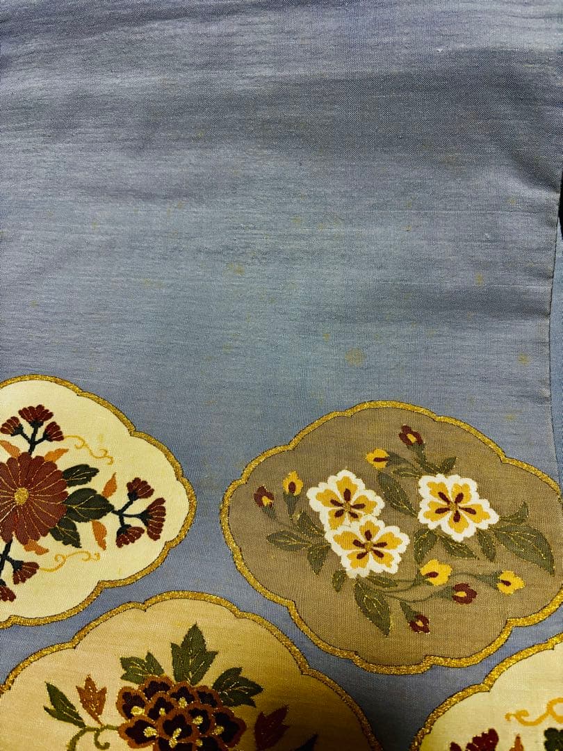 細かな明綴れ 青色 お太鼓柄