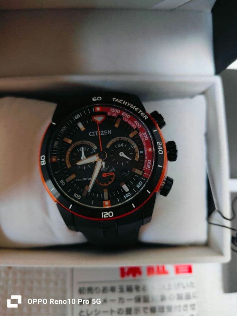 y３７３８１４　CITIZEN エコ・ドライブ ブラック/オレンジ