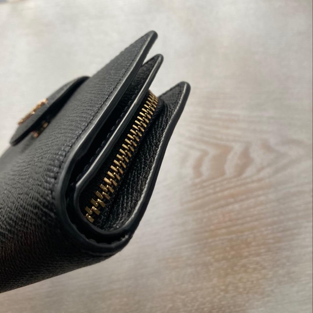 COACH コーチ　2つ折財布黒　ゴールド金具馬車ロゴ