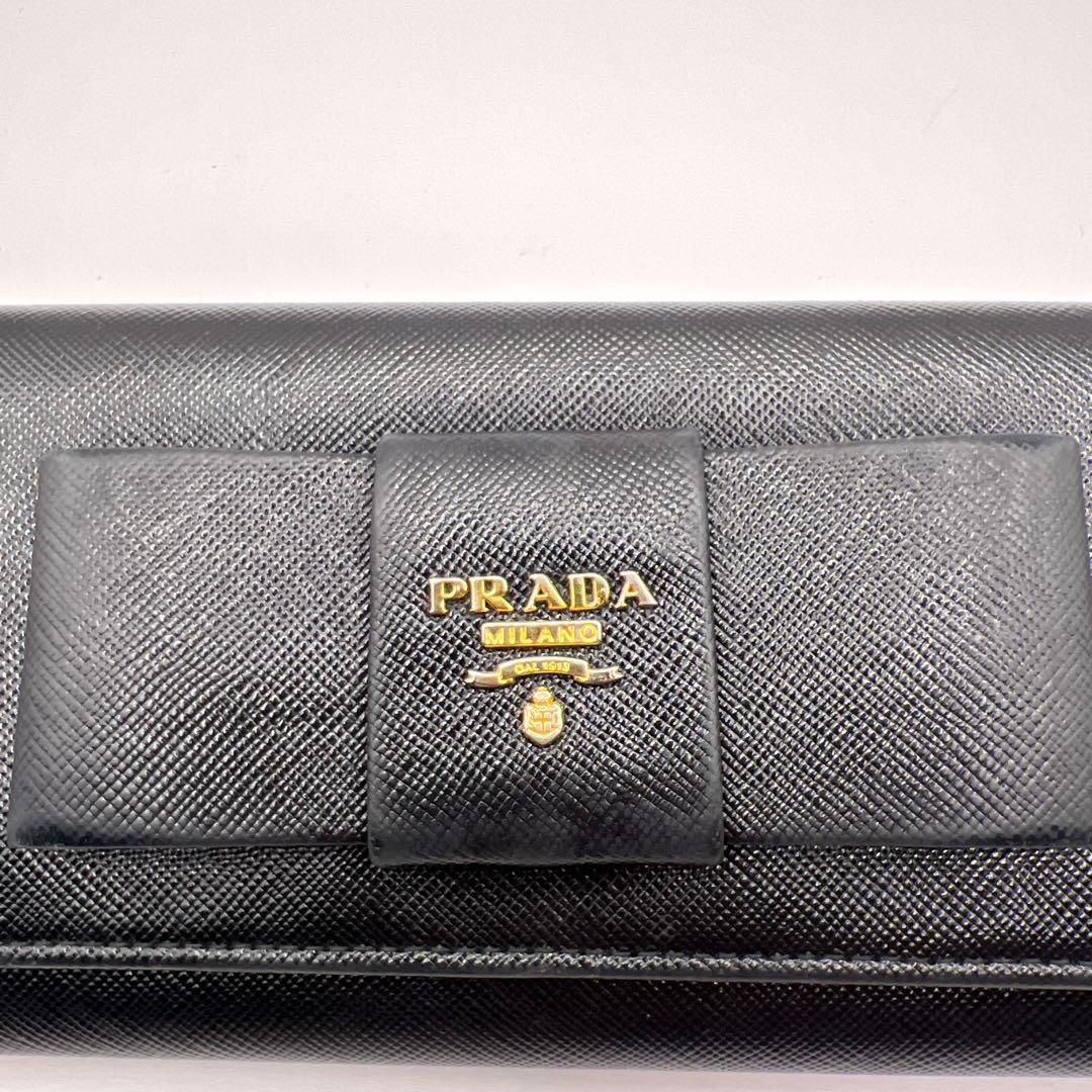 パン子プラダ　リボン　ブラック　長財布　ゴールドロゴ　スナップボタン