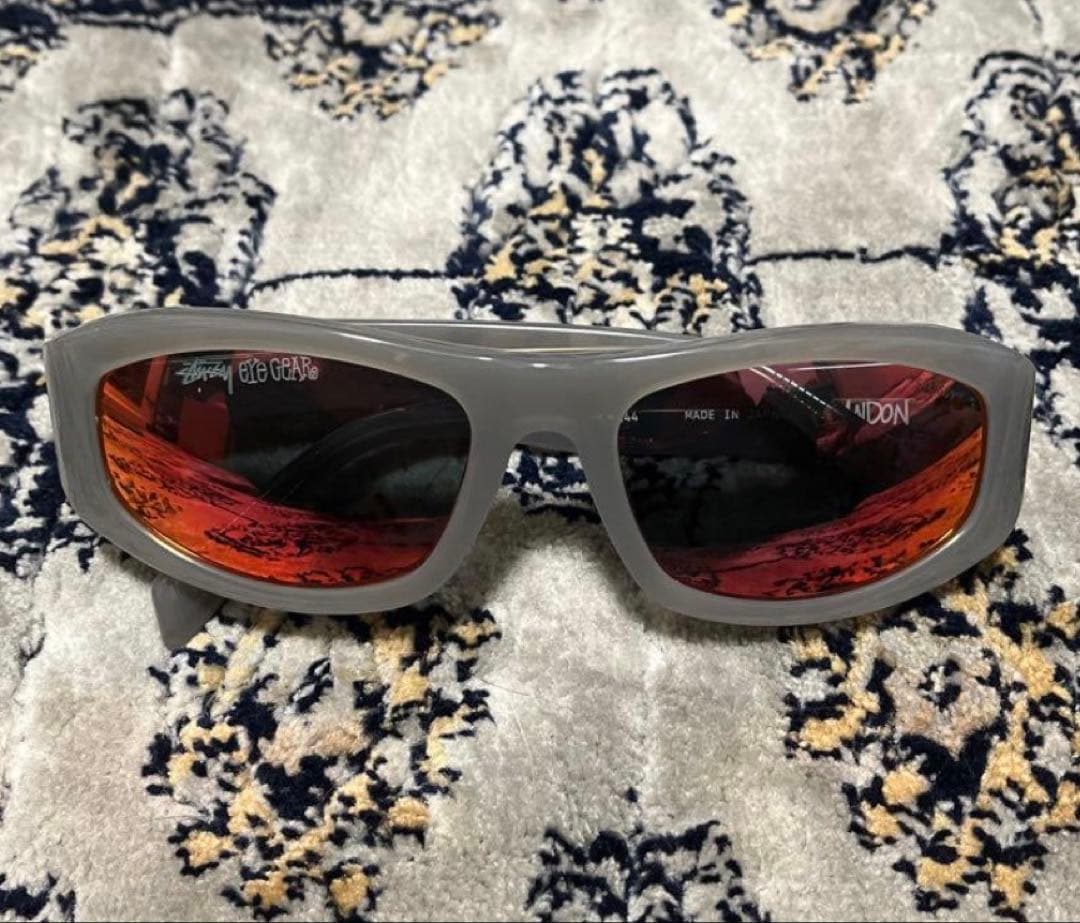 Stussy Eye Gear サングラス グレー/オレンジ