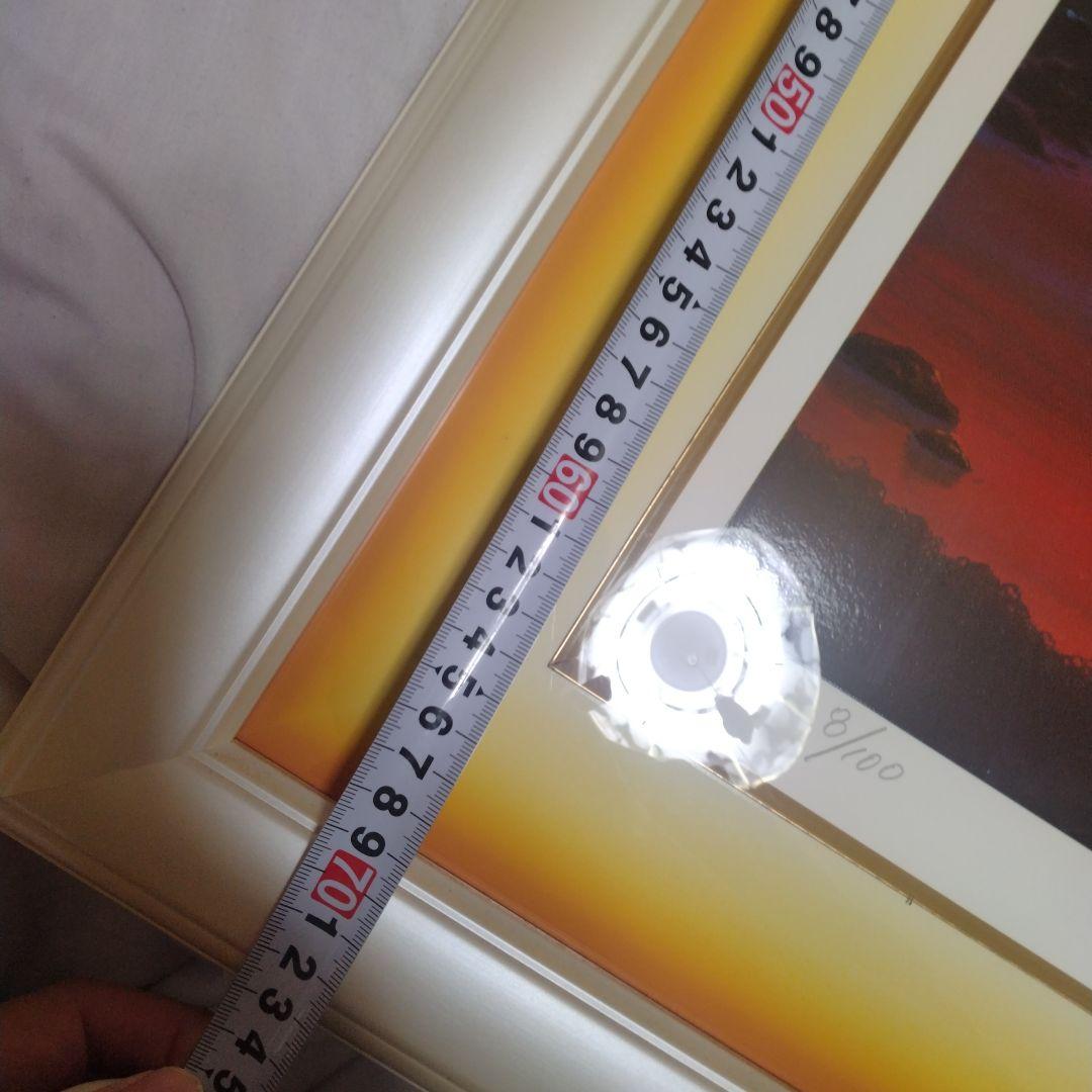 題名夕焼けの海、作者 Kim 、版画Ｎｏ．8/100です。