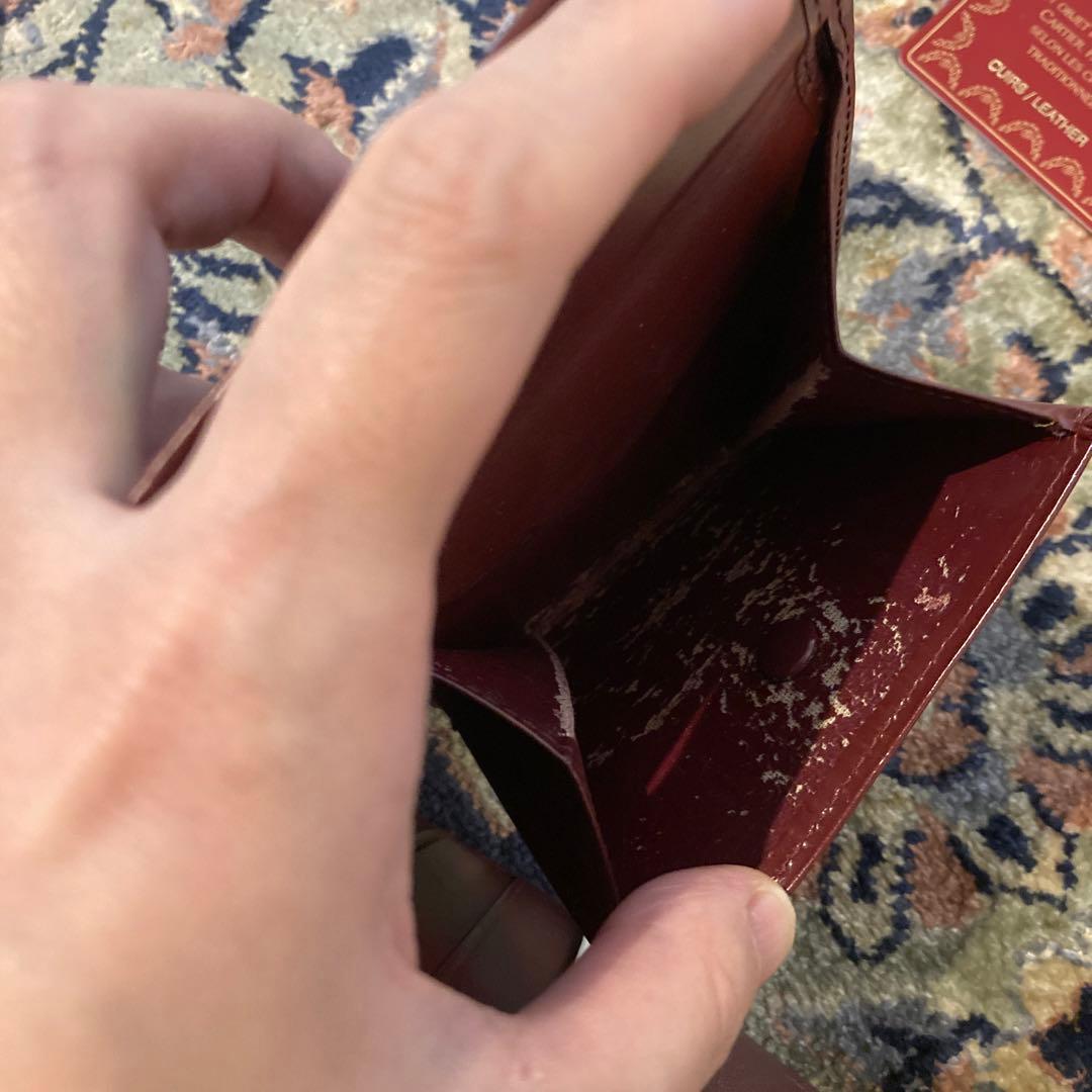 Cartier カルティエ　エンボスロゴ　二つ折り財布 ボルドー