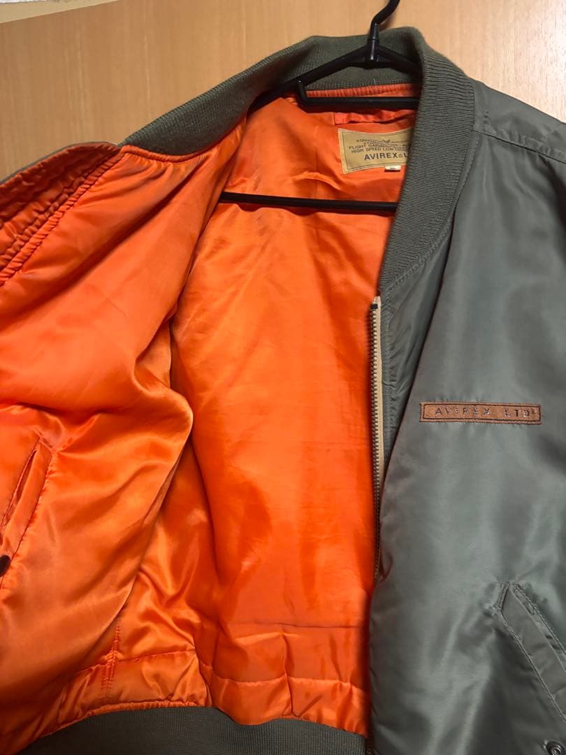 大人気モデル！AVIREX MA-1 COMMERCIAL LOGO