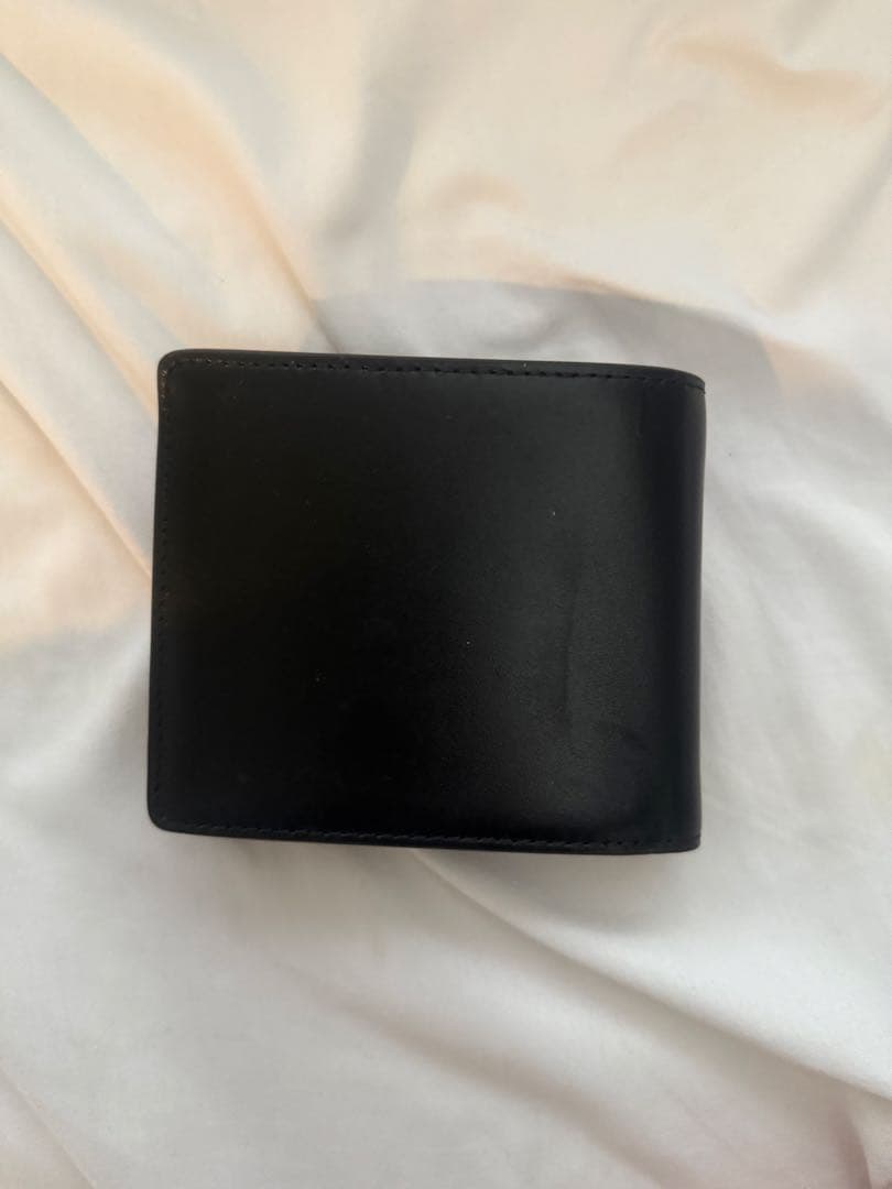 DIESEL黒のレザー二つ折り財布 ロゴ入り