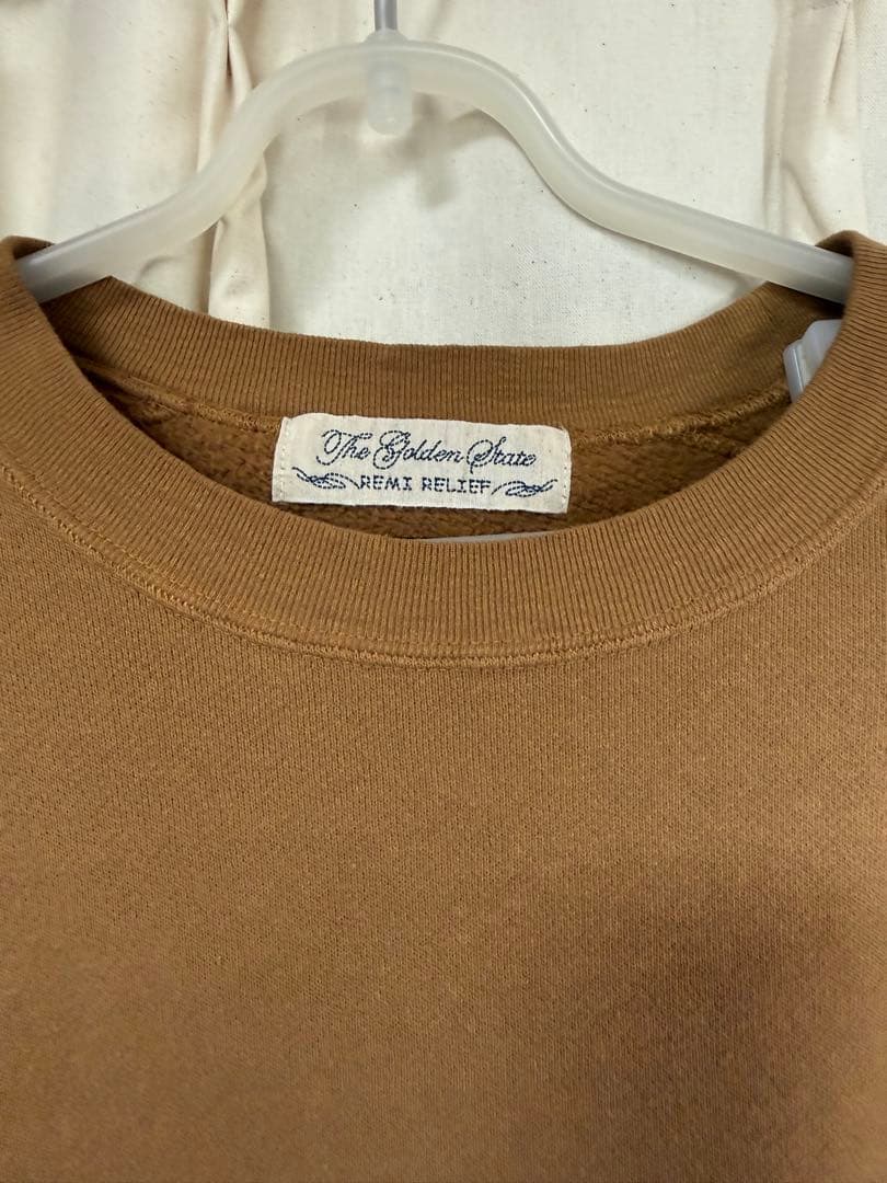 REMI RELIEF × HUG Õ WäR THIS WAYキャメル