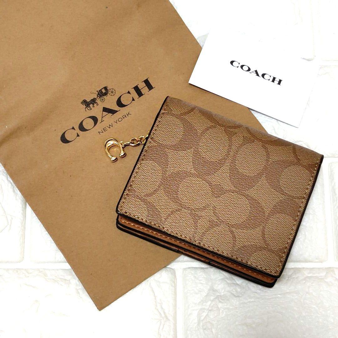 新品未使用⭐COACH ブラウン 二つ折り財布　シグネチャー　馬車ロゴ