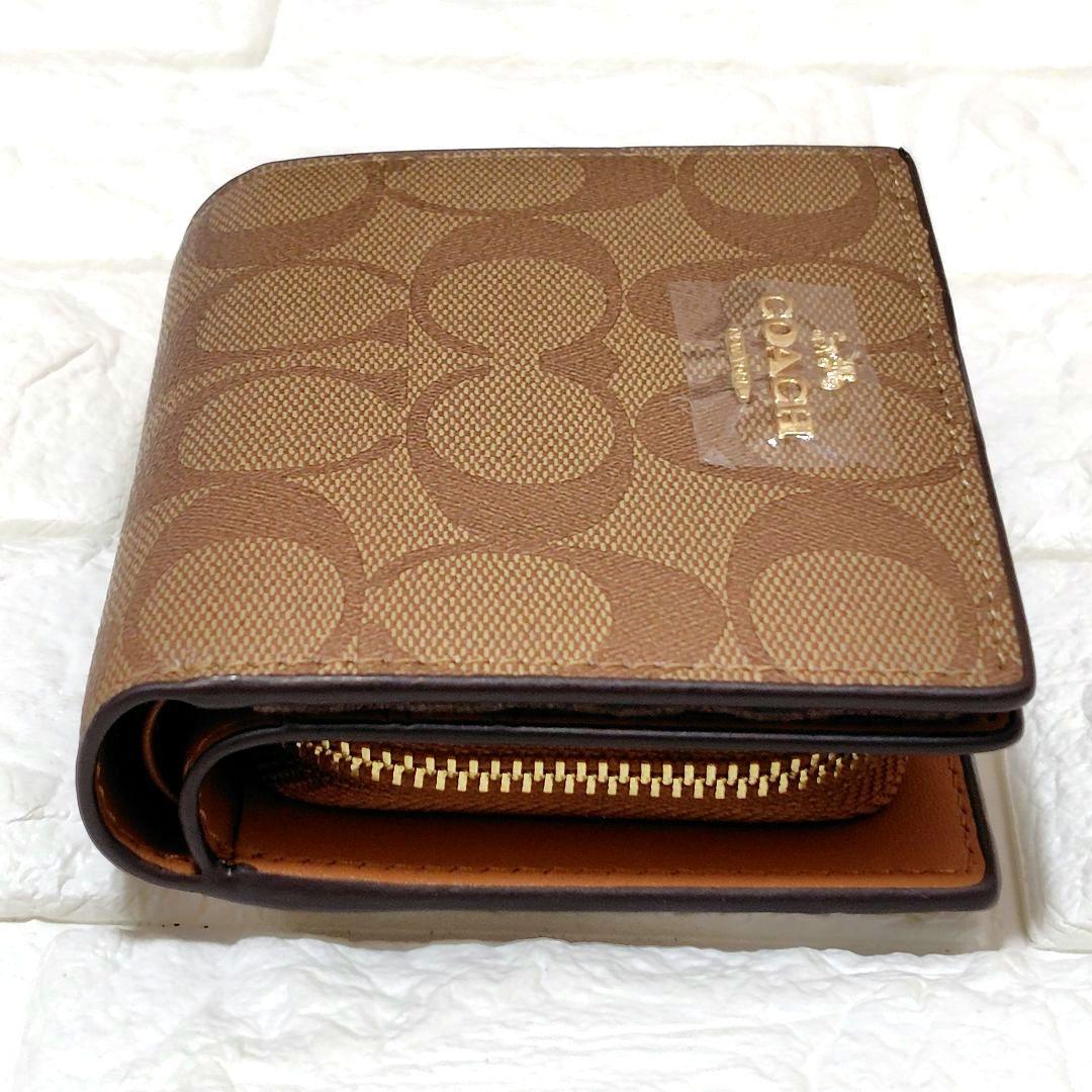 新品未使用⭐COACH ブラウン 二つ折り財布　シグネチャー　馬車ロゴ