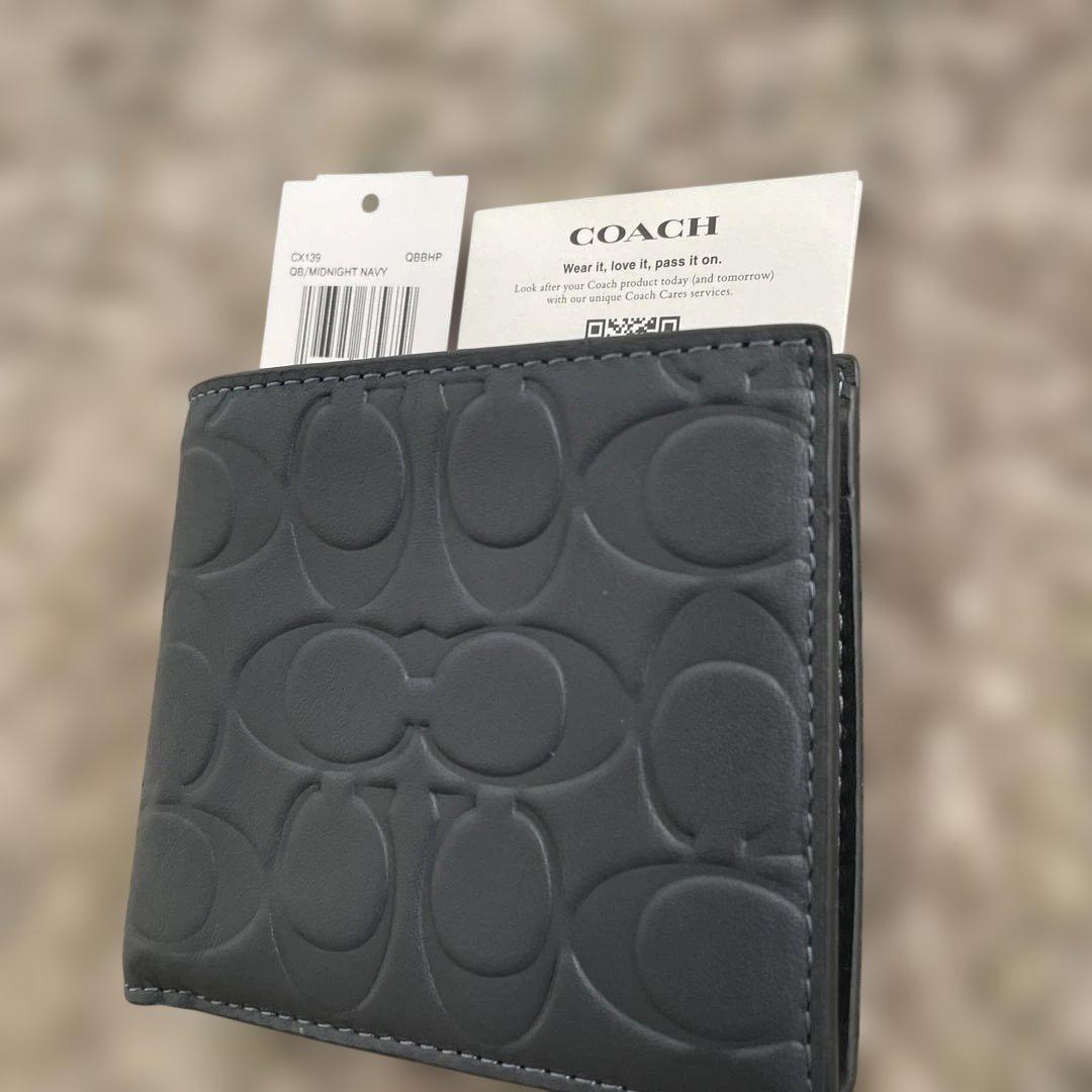 新品未使用　55,000円　COACH ミッドナイトネイビー 二つ折り財布