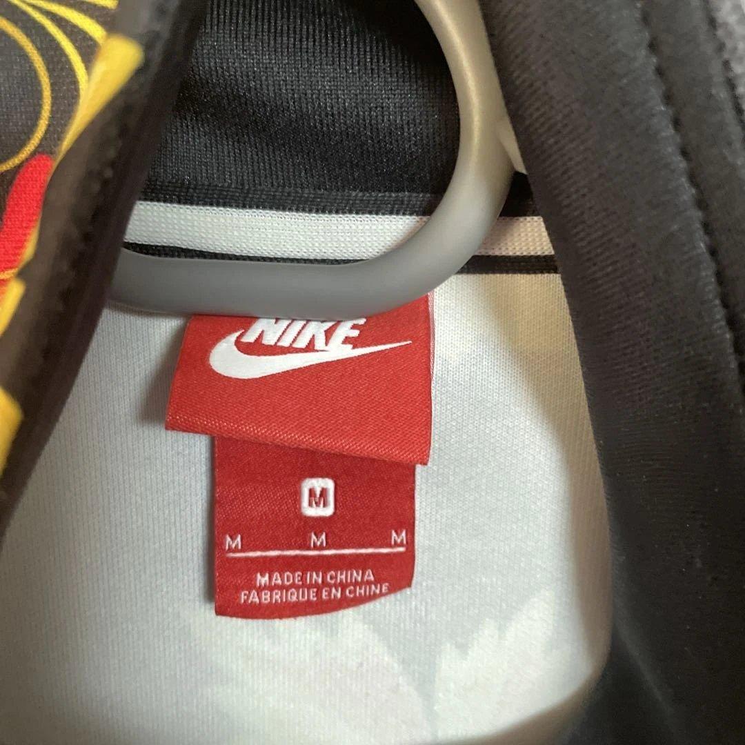 Nike 花柄ジャージ 黒/黄色/赤