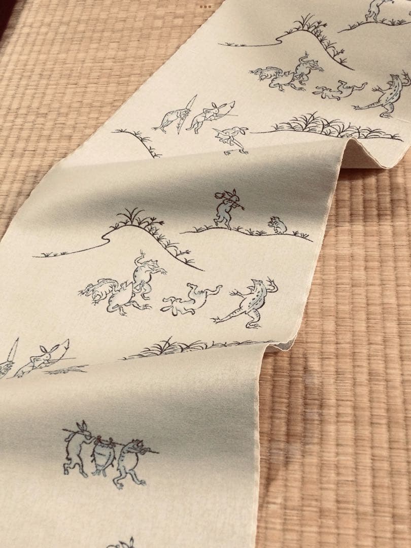 素敵な装い！西陣名古屋帯 綿芯手縫い仕立、ガード加工付 「鳥獣人物戯画」クリーム