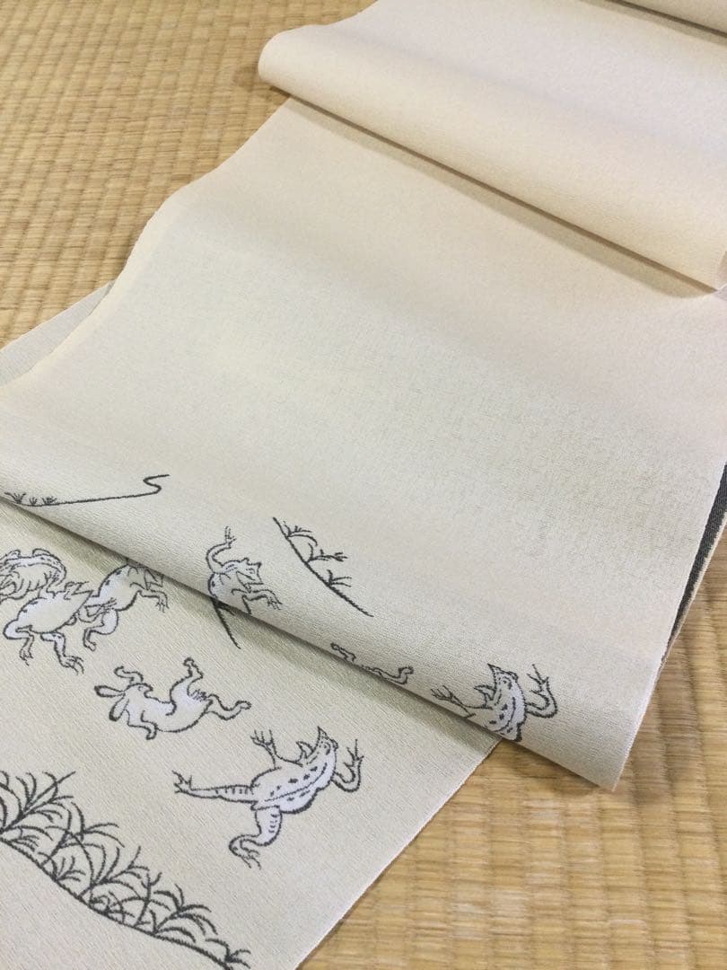素敵な装い！西陣名古屋帯 綿芯手縫い仕立、ガード加工付 「鳥獣人物戯画」クリーム