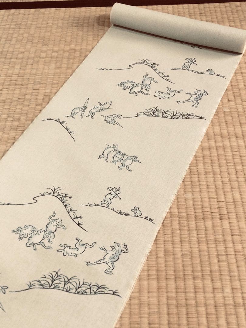 素敵な装い！西陣名古屋帯 綿芯手縫い仕立、ガード加工付 「鳥獣人物戯画」クリーム