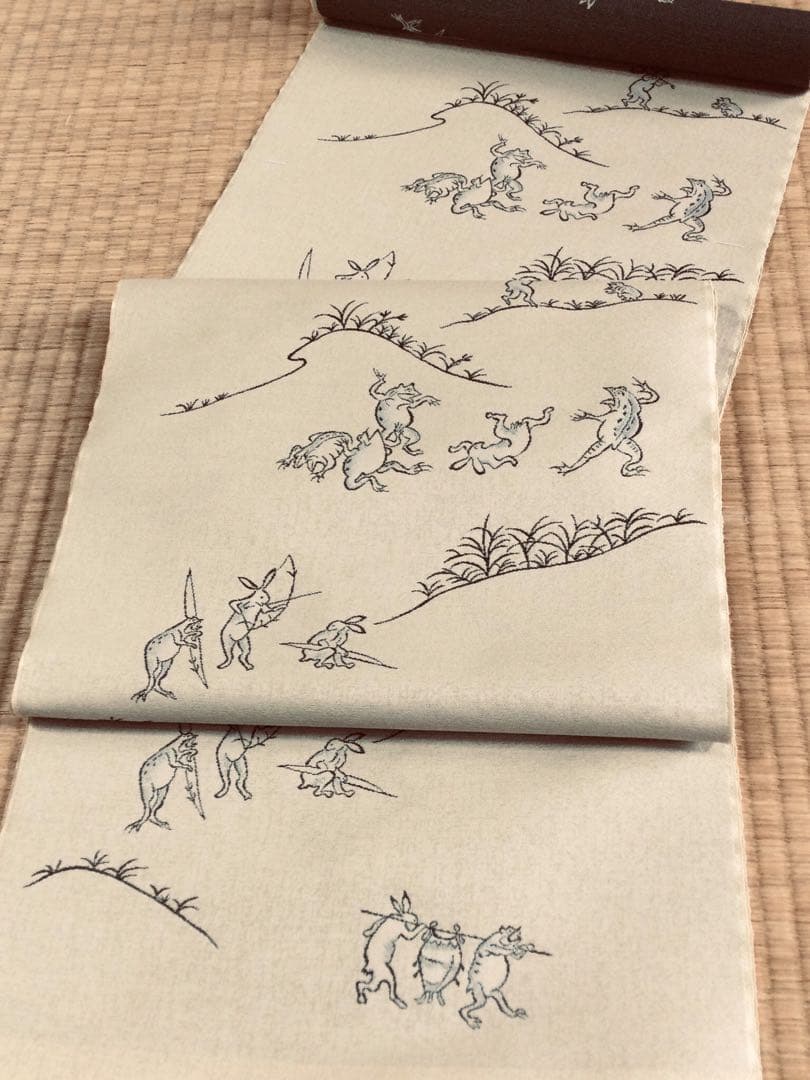 素敵な装い！西陣名古屋帯 綿芯手縫い仕立、ガード加工付 「鳥獣人物戯画」クリーム