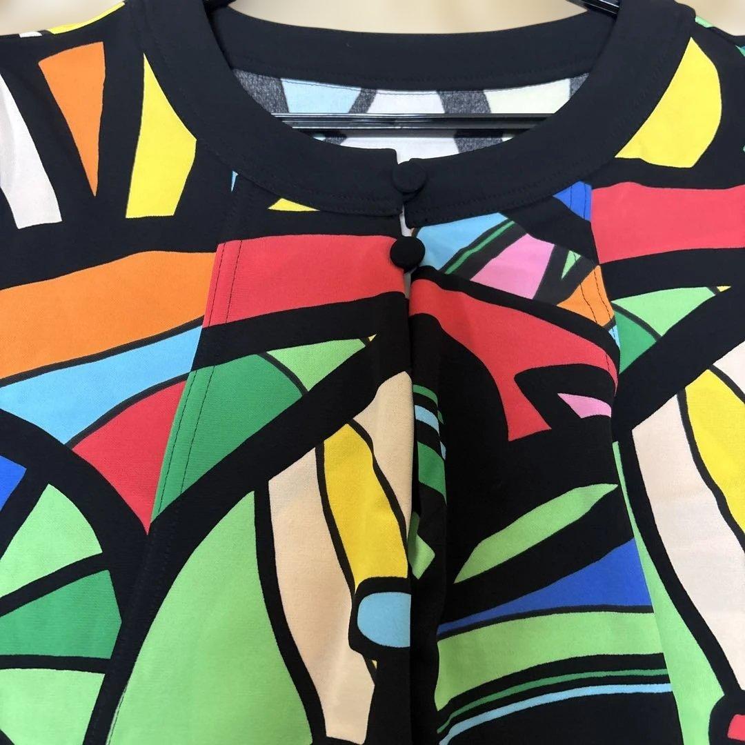 【新品未使用】✨トクコプルミエヴォル✨黒地に前開き陽気なカラフル柄のチュニック❣️