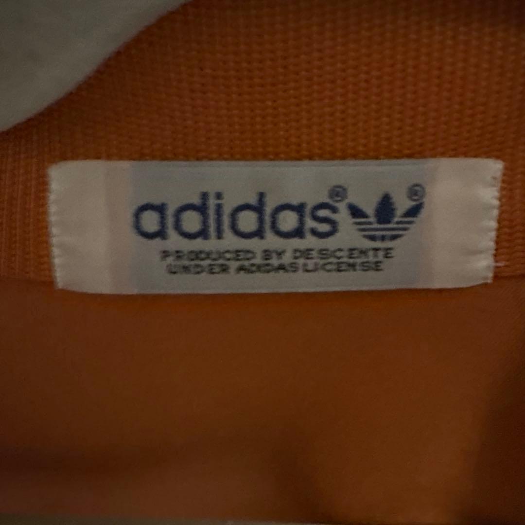 adidas アディダス トラックジャケット オレンジ 黒
