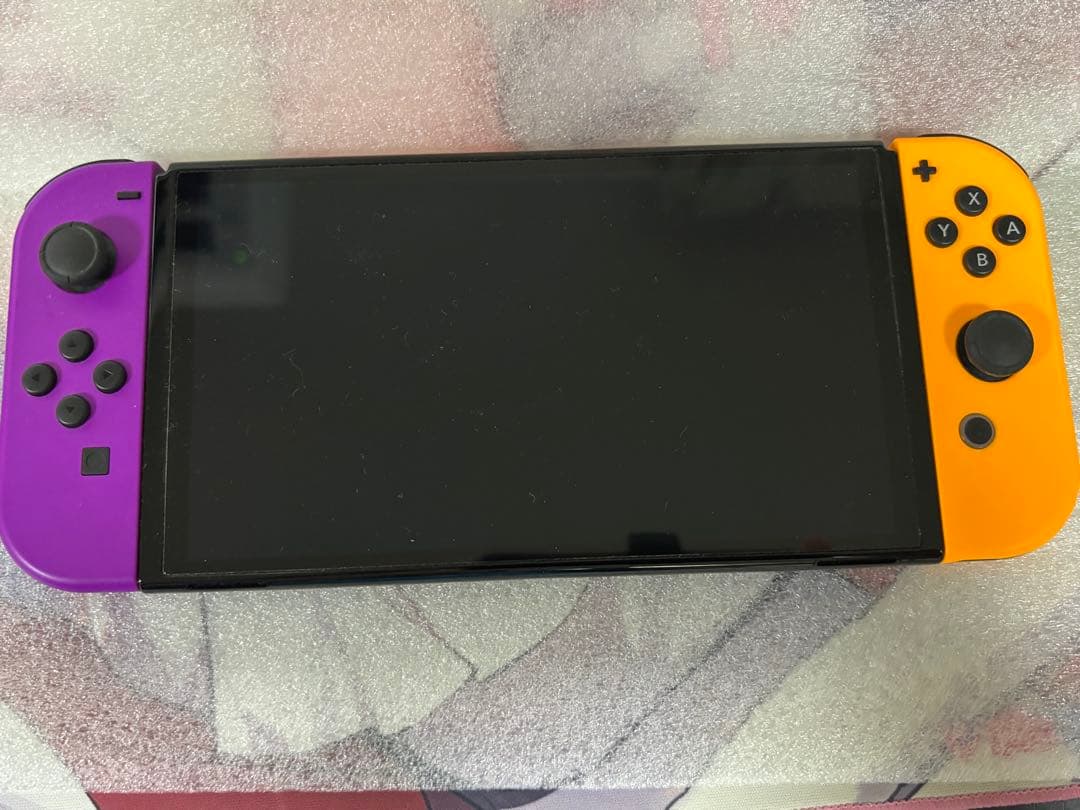 Nintendo Switch 本体 + 紫オレンジ JoyCon 付