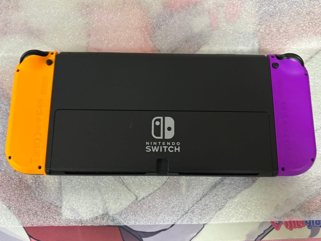 Nintendo Switch 本体 + 紫オレンジ JoyCon 付