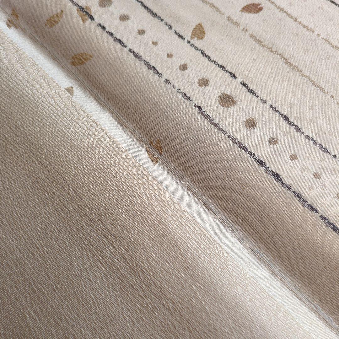 未使用　正絹袋帯　河瀬満織物　横段に花弁散らし　証紙アリ