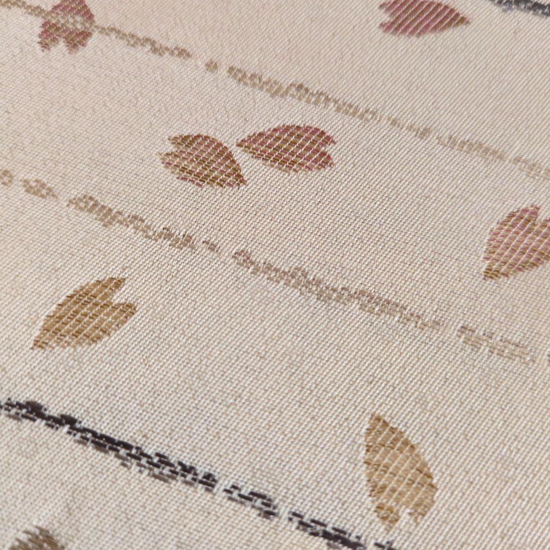 未使用　正絹袋帯　河瀬満織物　横段に花弁散らし　証紙アリ