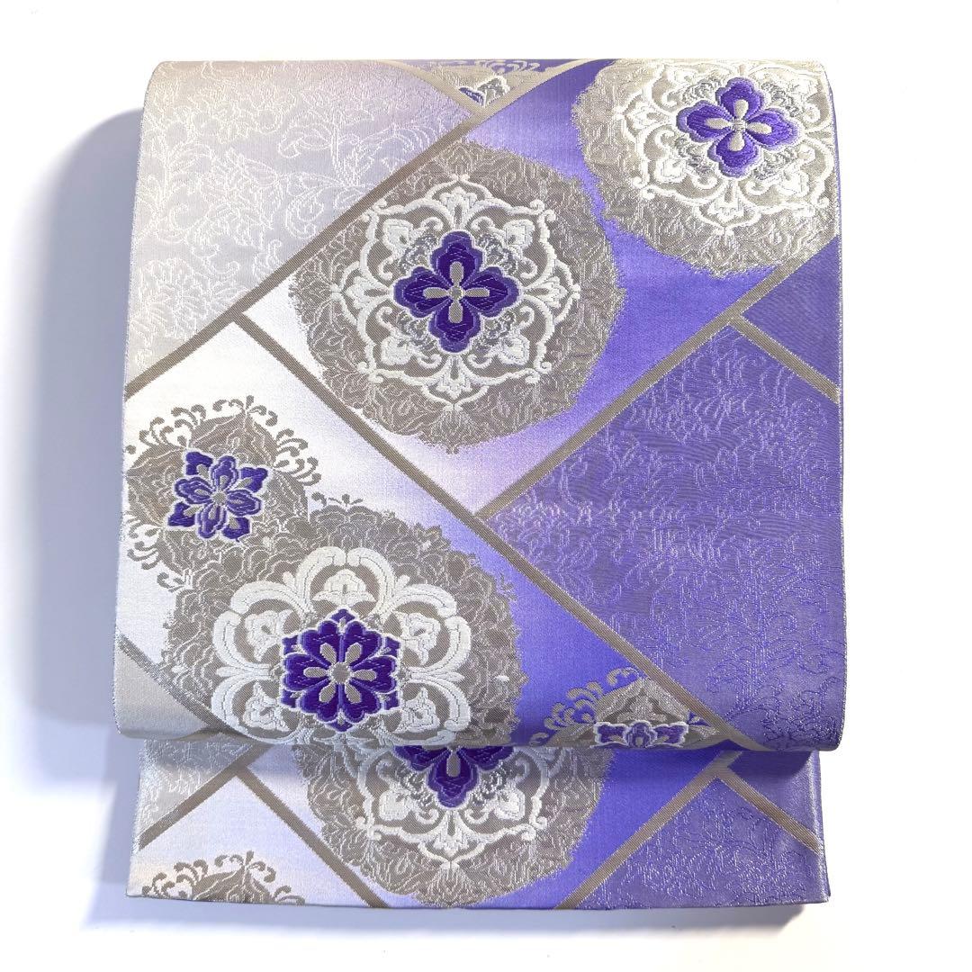 5k2491 袋帯　絹　唐織　正倉院文様　華文　紫　銀色　白　花柄　和装　着物