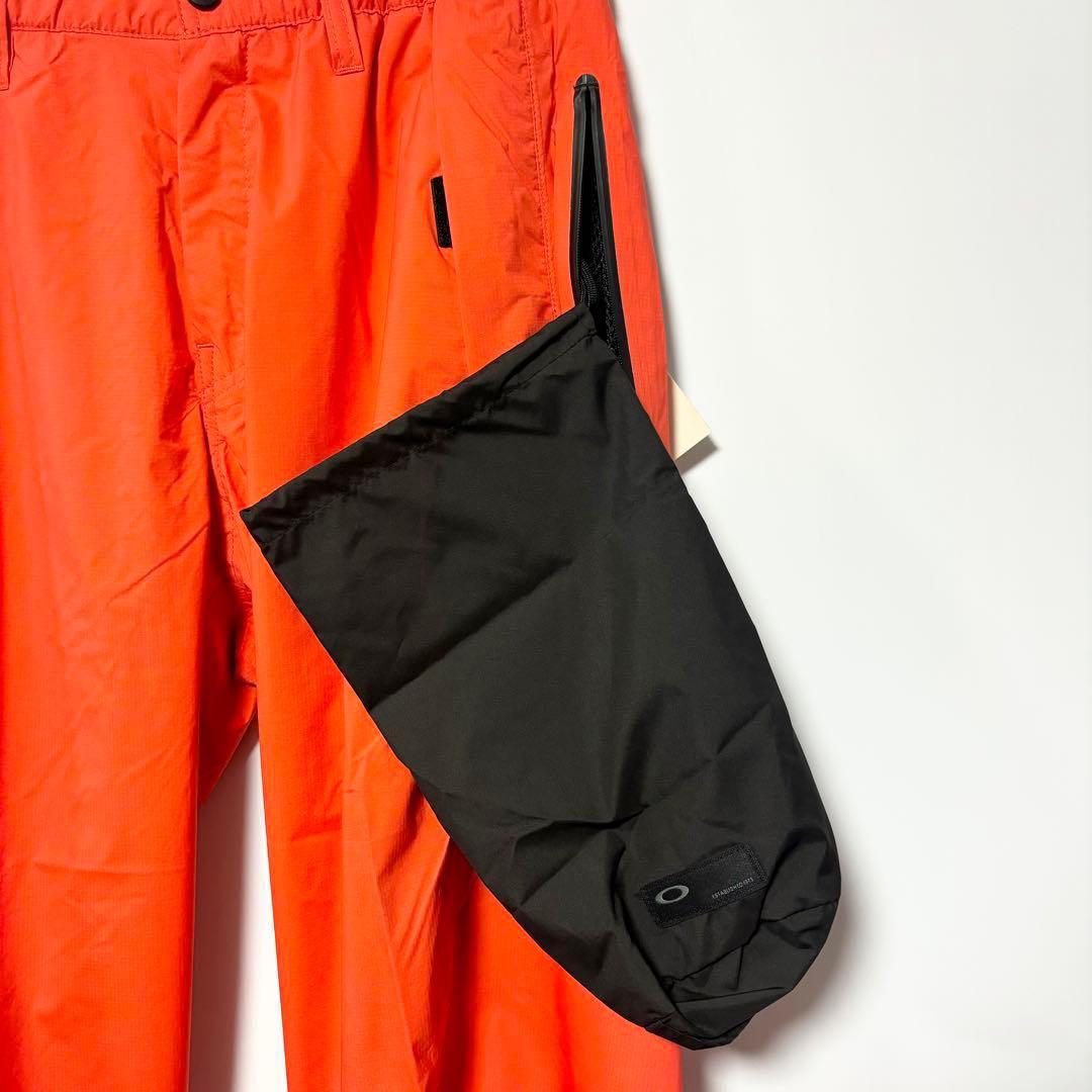 オークリー ゴルフ スカル スタウンチ 3D レインパンツ フレアオレンジ M