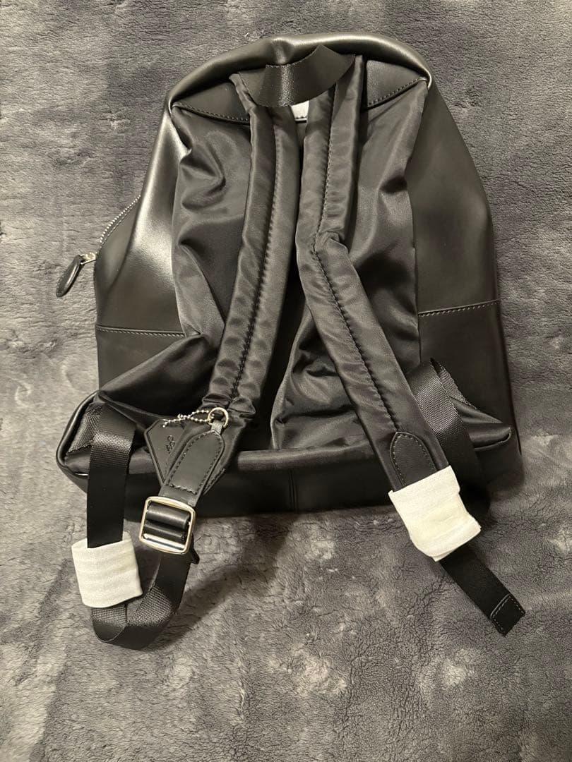 未使用・保存袋・説明書・ストラップ付き　COACH ブラック リュック
