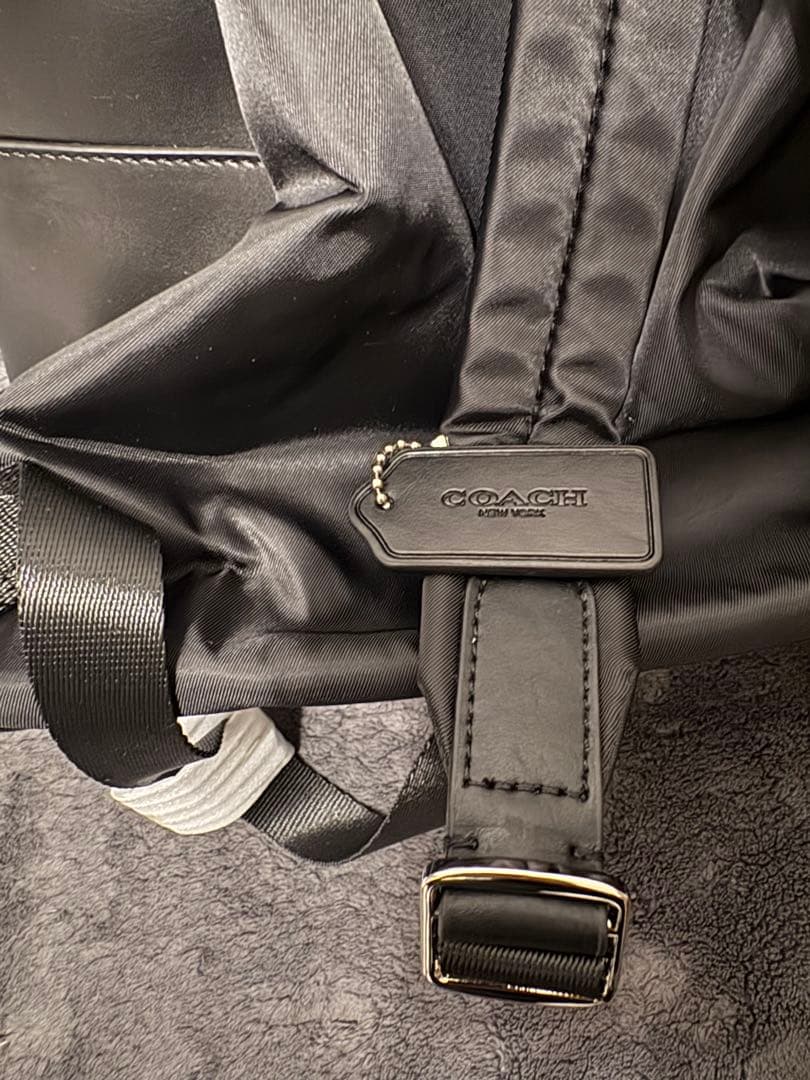 未使用・保存袋・説明書・ストラップ付き　COACH ブラック リュック