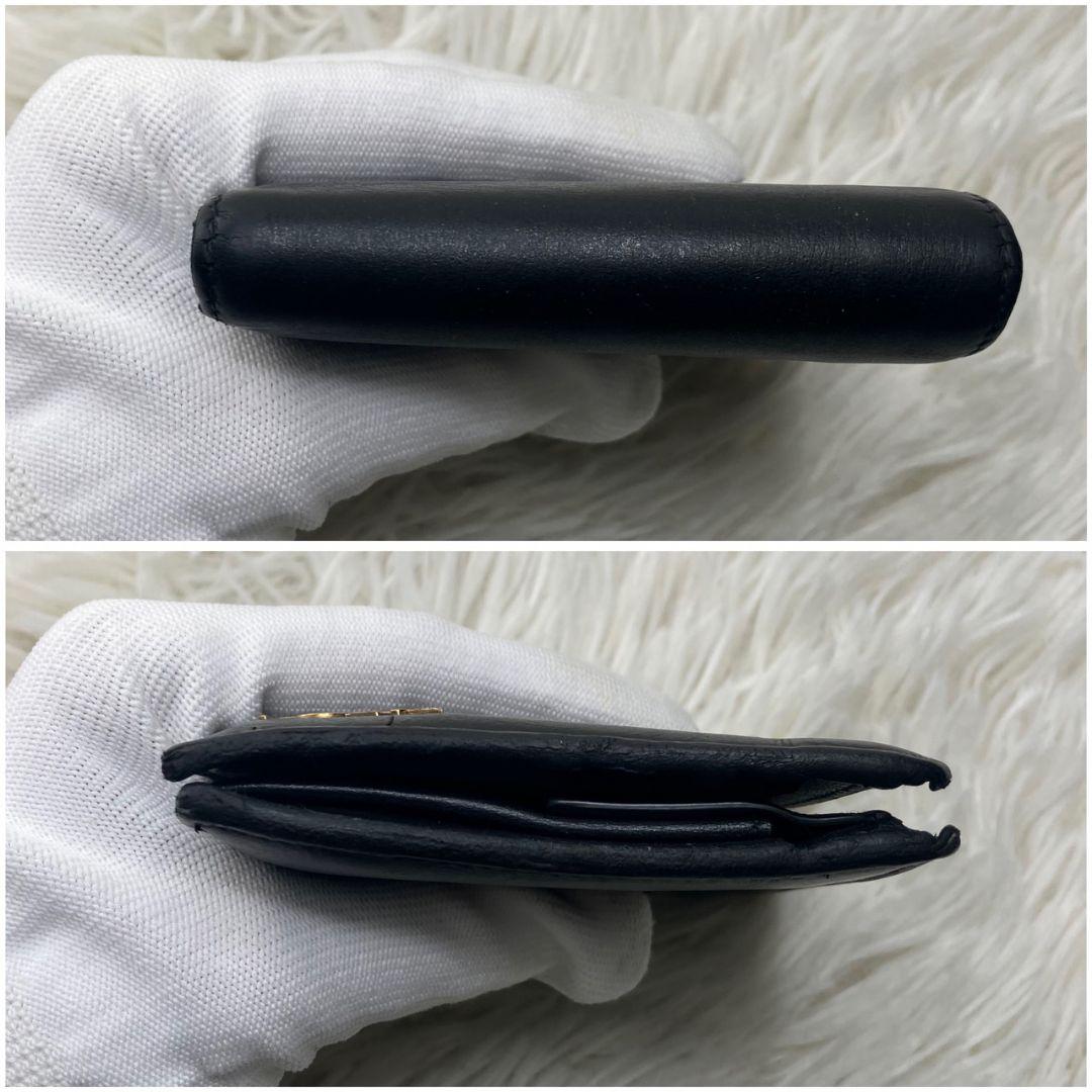 サンローラン 二つ折り財布 レザー カサンドラ 金具 ロゴ 黒 小銭入れ