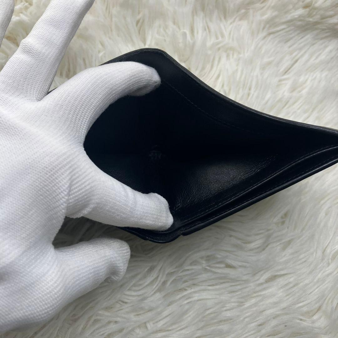 サンローラン 二つ折り財布 レザー カサンドラ 金具 ロゴ 黒 小銭入れ