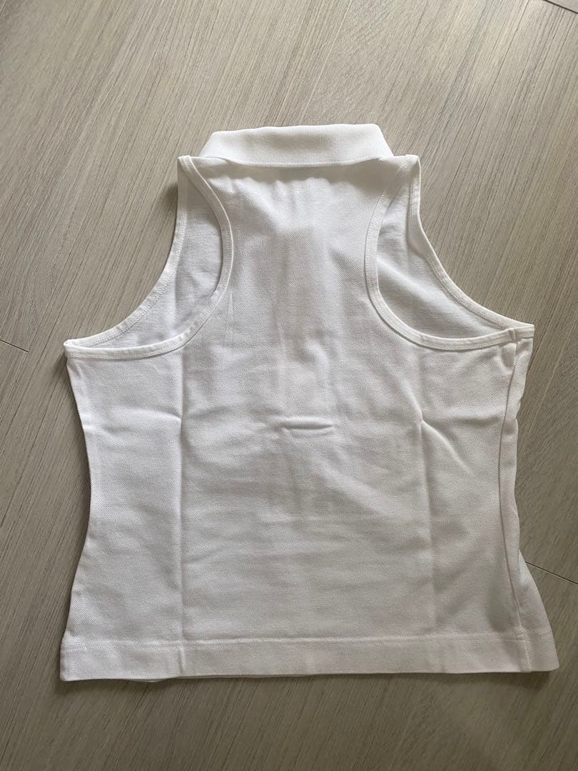 LACOSTE ホワイト ノースリーブポロシャツ