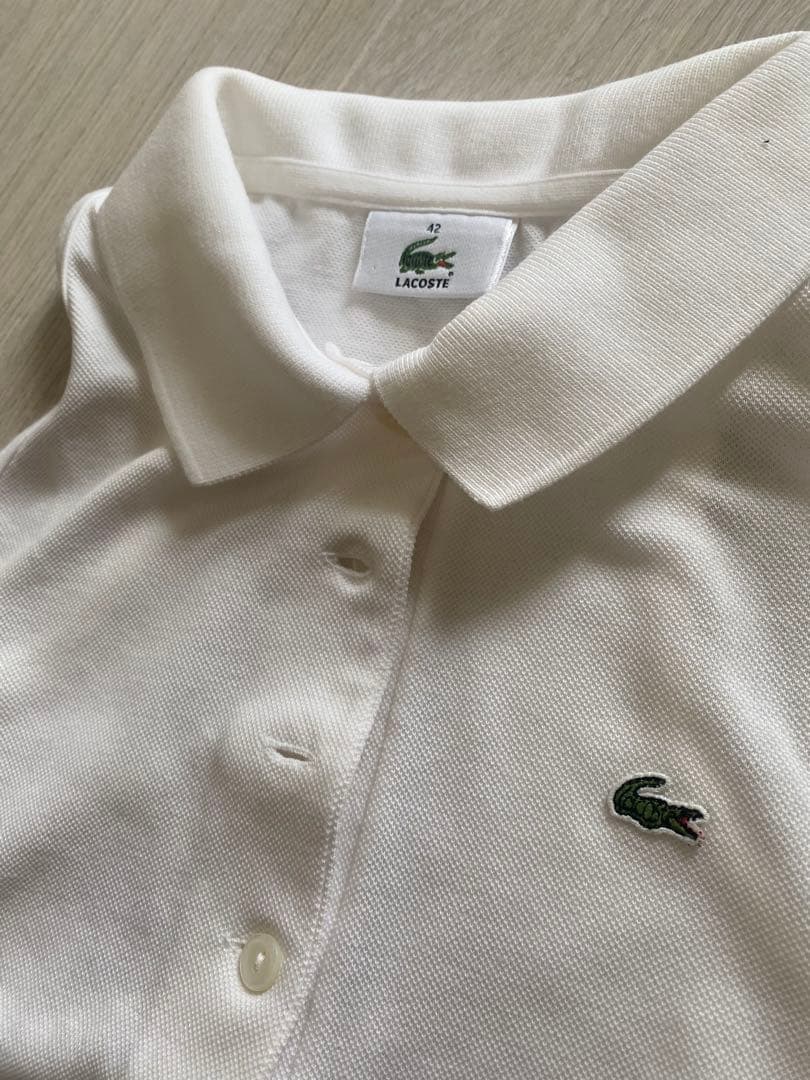 LACOSTE ホワイト ノースリーブポロシャツ