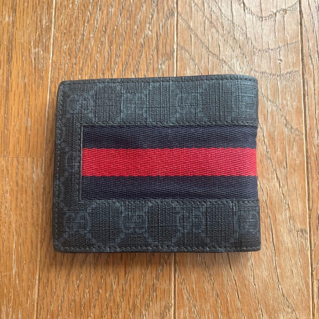 GUCCI 二つ折り財布 黒 赤ストライプ