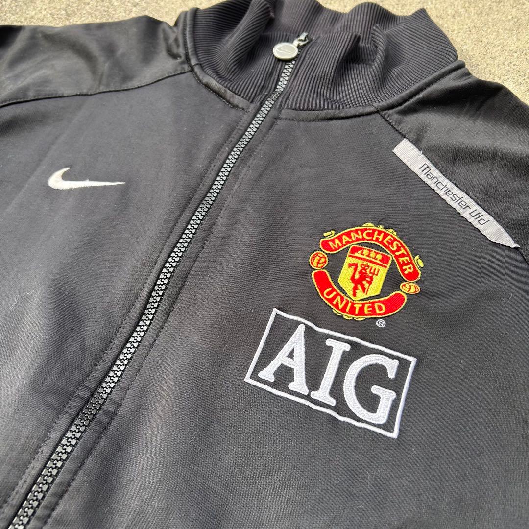 【希少】マンチェスター・ユナイテッド トラックジャケット L相当 黒 ロゴ刺繍