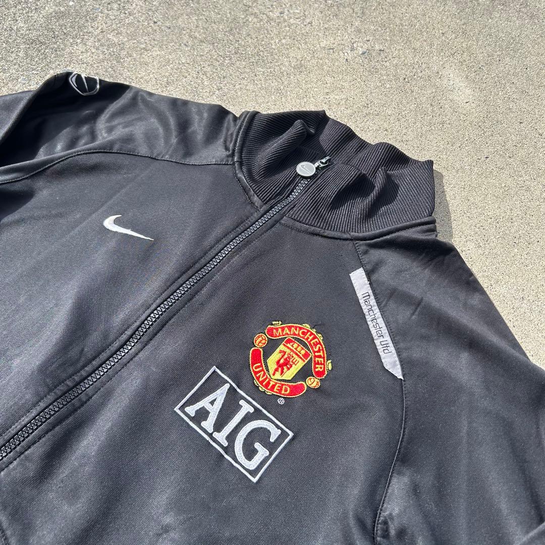 【希少】マンチェスター・ユナイテッド トラックジャケット L相当 黒 ロゴ刺繍