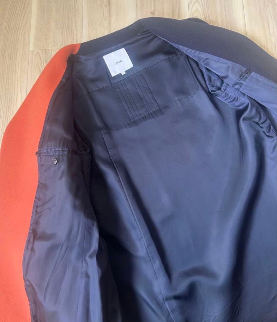 UN3D. アンスリード バイカラーアシンメトリーコート オレンジ×ネイビー