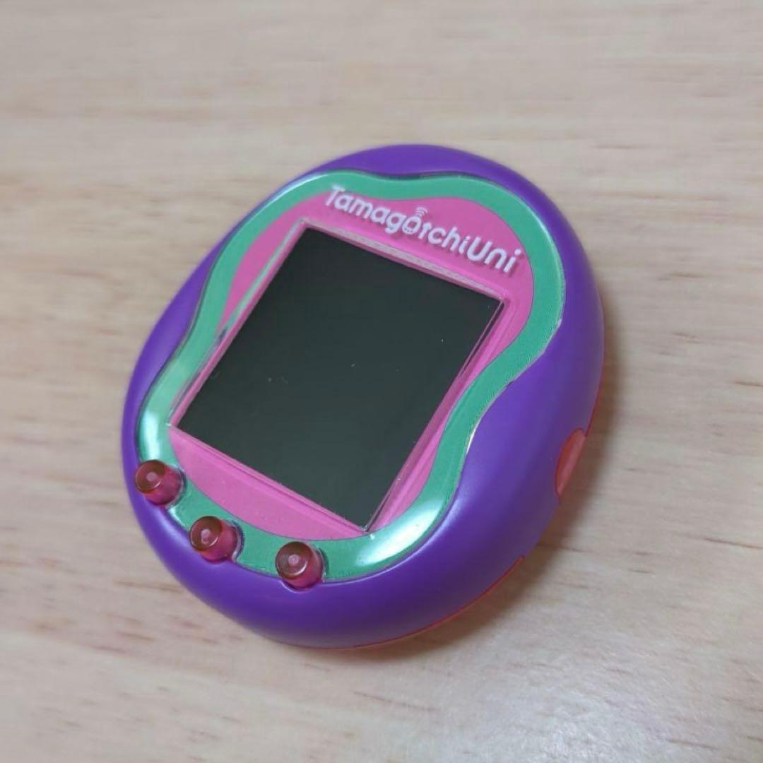 美品　たまごっちユニ　パープル　シリコンカバー ガイドブック付