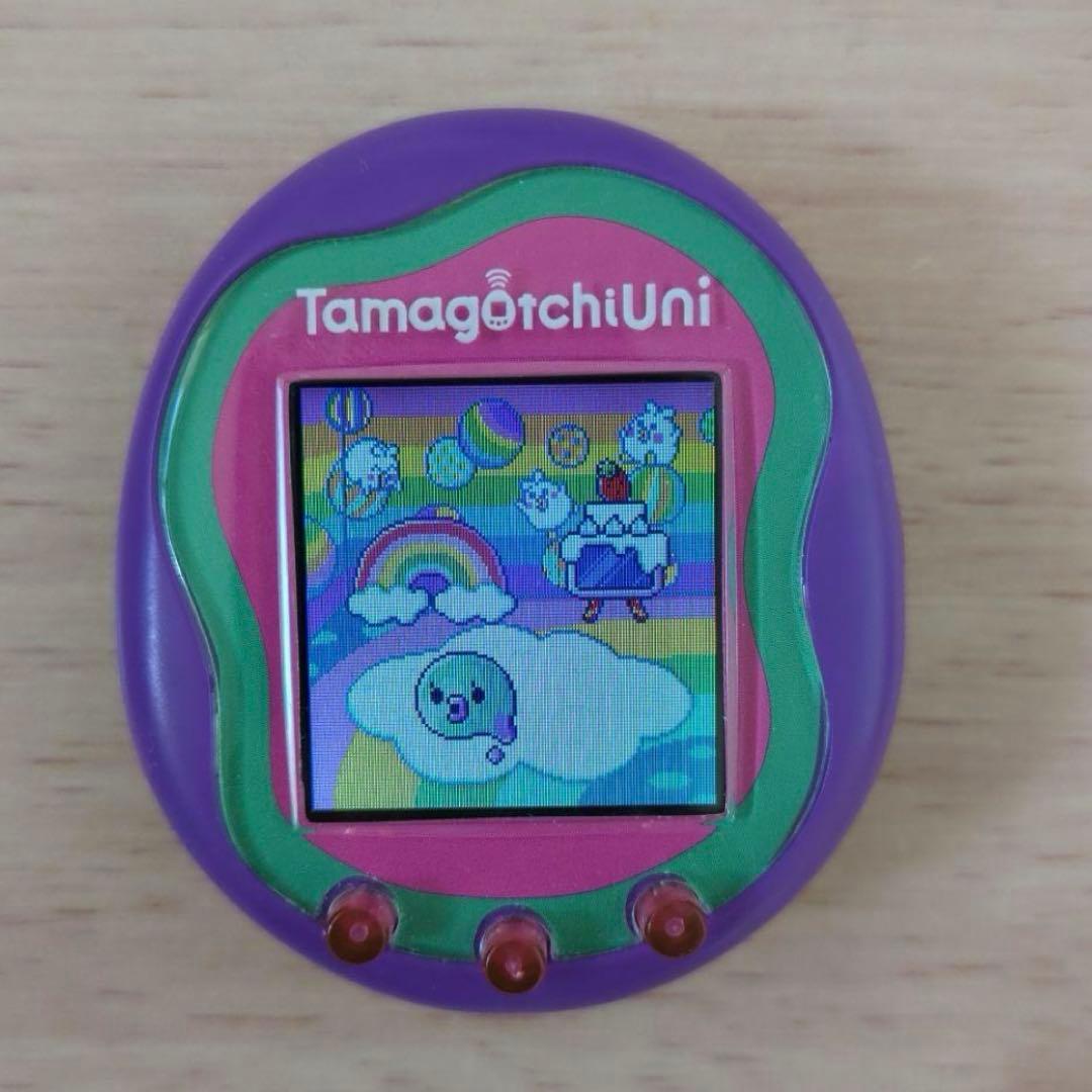 美品　たまごっちユニ　パープル　シリコンカバー ガイドブック付