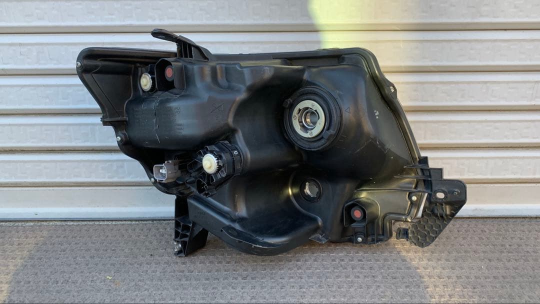 タントカスタム　左ヘッドライト　LA600S