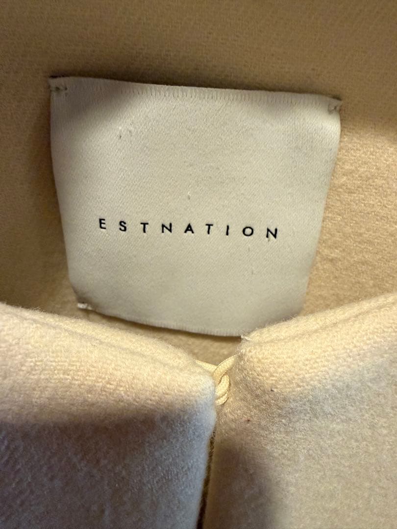 アイボリー ノーカラージャケット フレアスリーブ