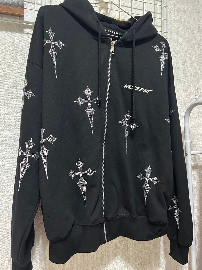 レフレムラインストーンクロス総柄長袖ジップアップパーカー