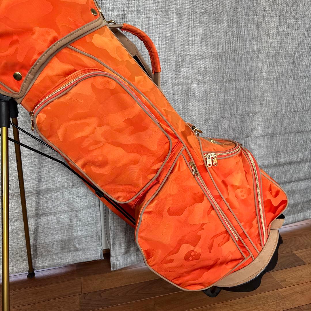 マークアンドロナ 迷彩 カモフラ ゴルフ キャディバッグ オレンジ